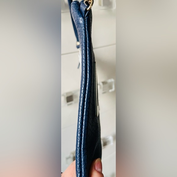 A navy blue shoulder and wristlet, adjustable strap to also wear as a crossbody - Picture 8 of 12